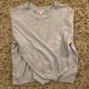 Blue sweater (says Sunday on it)